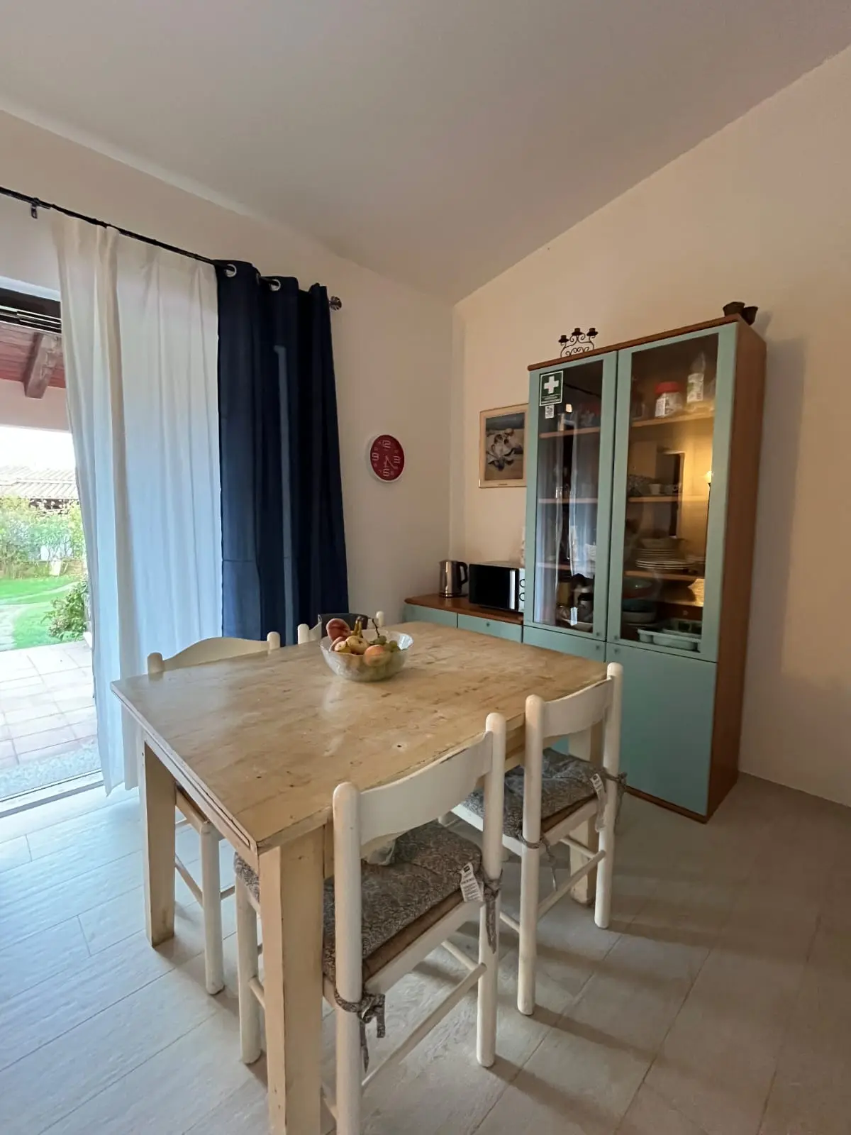 Dining table for four and vintage sea-green kitchen cupboard